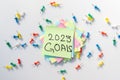 2023 goals hand written on a yellow notepad page with isolated white background Royalty Free Stock Photo