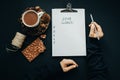 2018 goals list with woman hands, pencil, chocolate, cocoa, cone Royalty Free Stock Photo