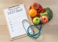 2021 goals on medical clipboard note pad for new year reminder list of yearly planner  health plan for for cholesterol diet Royalty Free Stock Photo