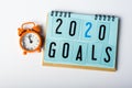 2020 Goals. New year goal, plan, action text on notepad with orange clock. Business motivation concepts ideas Royalty Free Stock Photo