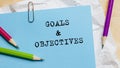 Goals Objectives text written on a paper with pencils in office