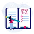 2020 Goals, plans, actions on notebook. Woman with pen writes motivation and inspiration for New Year Royalty Free Stock Photo