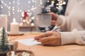 Goals plans make to do and wish list for new year christmas concept, girl writing in notebook. Woman hand holding pen on Royalty Free Stock Photo