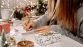 Goals plans make to do and wish list for new year christmas concept, girl writing in notebook. Woman hand holding pen on Royalty Free Stock Photo