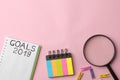 goals 2019. text in a notebook with colored stickers and a magnifying glass on a bright pink background Royalty Free Stock Photo