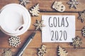 Goals for 2020 word on paper with pen and coffee cup on wooden table. Business concept Royalty Free Stock Photo