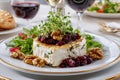 Goat cheese appetizer with cranberries walnuts microgreens and salad Royalty Free Stock Photo