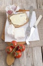 Goat cheese and bread on a wooden board Royalty Free Stock Photo