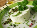 Goat cream cheese with herb marinade Royalty Free Stock Photo