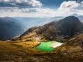 Panoramic view of Carpathian Mountains with green lake. Royalty Free Stock Photo