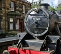 Steam train and the station buildings Royalty Free Stock Photo