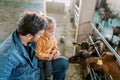 Goats sniff through the fence a little girl sitting on her dad lap Royalty Free Stock Photo