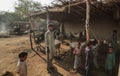 Goats And Villager Standing Inside The House