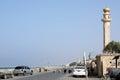 Goats wander past the Beach mosque along the sea-front road at Al Khabourah, Oman Royalty Free Stock Photo