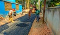 Male workers build road with asphalt