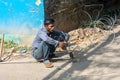 Man working with electrical wires without wearing safety gears