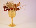 Goblet with dead flowers
