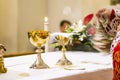 Cup with wine and ciborium with host on the altar of the holy mass Royalty Free Stock Photo