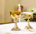 Cup with wine and ciborium with host on the altar of the holy mass Royalty Free Stock Photo