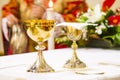 Cup with wine and ciborium with host on the altar of the holy mass Royalty Free Stock Photo