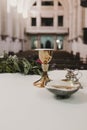 Goblet of wine on table during a wedding ceremony nuptial mass. Religion concept. Catholic eucharist ornaments for the celebration Royalty Free Stock Photo