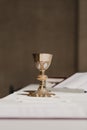 Goblet of wine on table during a wedding ceremony nuptial mass. Religion concept Royalty Free Stock Photo