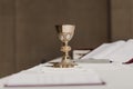 Goblet of wine on table during a wedding ceremony nuptial mass. Religion concept Royalty Free Stock Photo