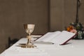 Goblet of wine on table during a wedding ceremony nuptial mass. Religion concept