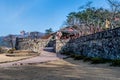 Gate pavilion behind stone fortress wall