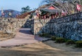 Gate pavilion behind stone fortress wall