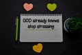 God Already Knows Stop Stressing write on a book on office desk. Christian faith concept