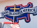 God Bless America sign with cross