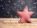 God Jul on small wooden blocks with a red checkered star shape Royalty Free Stock Photo