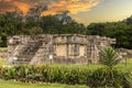 God Kukulkan on the platform of eagles and jaguars under a beautiful orange sunset. Concept pyramid of Chichen Itza Royalty Free Stock Photo