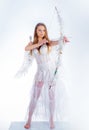 The God of Love. Bow and arrow. Lovely girl cupid with bow and arrow is ready to find your love. Teen angel. Royalty Free Stock Photo