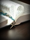 God is love, closeup pages of an open book, with heart shaped pages Royalty Free Stock Photo