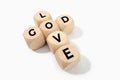 God is Love concept. Wooden blocks forming a cross Royalty Free Stock Photo