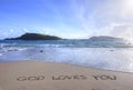 God Loves You written in sand on beach Royalty Free Stock Photo