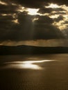 Gods rays and boats on the sea Royalty Free Stock Photo