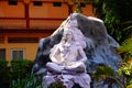 God Shiva in meditation with hills and mountains statue closeup image in front of building