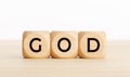 GOD word on wooden block on wood table Royalty Free Stock Photo