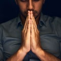 God, worship and man with hands praying for help, hope and guidance in dark studio. Pray, thank you and Christian male Royalty Free Stock Photo