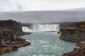 Godafoss Waterfall in Iceland with Mountain and Rocks in Background Royalty Free Stock Photo