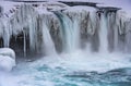 Godafoss Waterfall in Iceland, partially frozen in winter. Long exposure motion blur Royalty Free Stock Photo