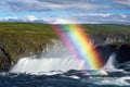 Godafoss waterfall and rainbow on a sunny day
