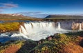 Godafoss waterfall at sunset. Fantastic landscape. Beautiful cumulus clouds. Royalty Free Stock Photo