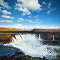 Godafoss waterfall at sunset. Fantastic landscape. Beautiful cumulus clouds. Iceland Royalty Free Stock Photo