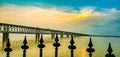 AsiaÃ¢â¬â¢s third largest road cum railway bridge crossing over the beautiful river Godavari at sunset.