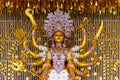 Goddess Durga idol at decorated Durga Puja pandal, shot at colored light, in Kolkata, West Bengal, India. Durga Puja is biggest Royalty Free Stock Photo