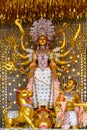 Goddess Durga idol at decorated Durga Puja pandal, shot at colored light, in Kolkata, West Bengal, India. Durga Puja is biggest Royalty Free Stock Photo